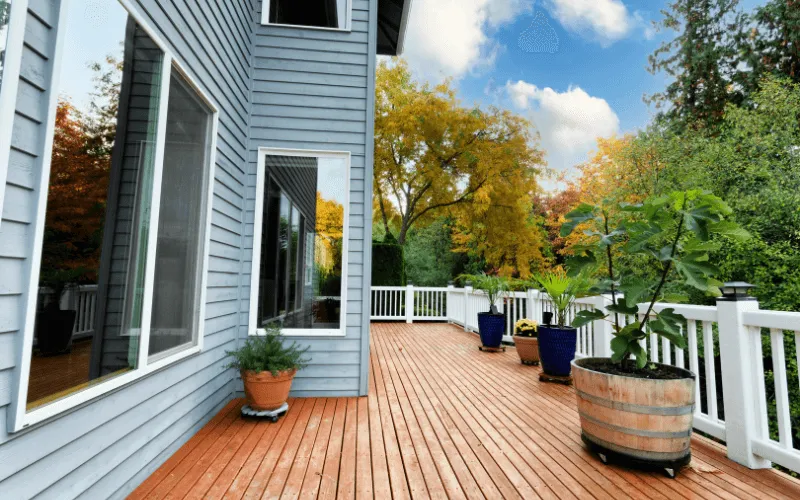 long-stained-wood-deck-white-ballusters-and-railings_result