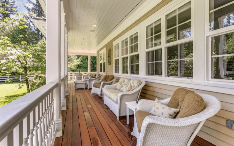 long-wood-stained-porch-white-ballusters-columns_result